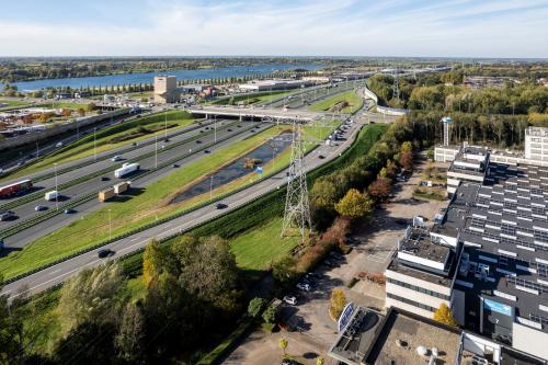 Aerial view of Utrecht Lage Weide, featuring Zonnebaan 45 amid an expanse of roads and greenery, ideal for office space rental.