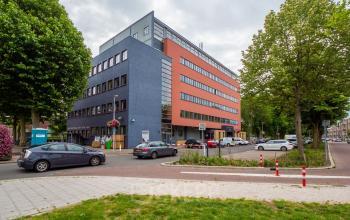 Modern office space rental at Goeman Borgesiuslaan 77 in Utrecht North with a multi-level building featuring a vibrant exterior.