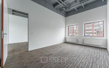 Bright office space at Goeman Borgesiuslaan 77, Utrecht North, with large windows and modern carpeting, ideal for business professionals seeking office space rental.