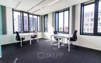 Bright office to rent at Papendorpseweg 95-97 in Utrecht Papendorp, featuring large windows and multiple desks. Ideal for office space rental with a modern work environment.