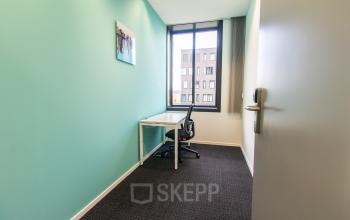 Bright office space with a desk and chair near a window at Papendorpseweg 95-97, Utrecht Papendorp, ideal for office space rental.