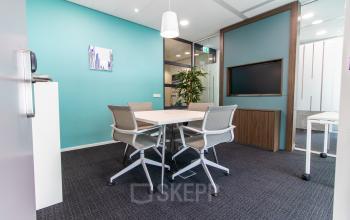 Modern office space for rent at Papendorpseweg 95-97, Utrecht Papendorp featuring a conference room with a table and chairs, ideal for office space rental.