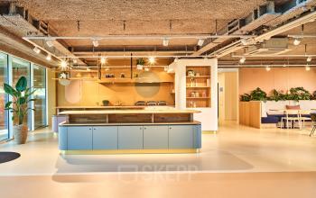 Spacious, modern office space rental at Van Deventerlaan 30-40, featuring an open floor plan with contemporary furnishings and vibrant décor in Utrecht Papendorp.