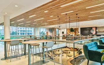 Bright, furnished office space at Van Deventerlaan 30-40 in Utrecht Papendorp with modern seating and large windows. Ideal for office space rental.