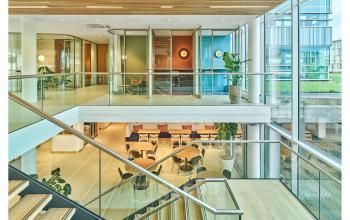 Modern office interior at Van Deventerlaan 30-40 in Utrecht Papendorp, featuring glass walls and workspaces available for rent, complementing office space rental options.