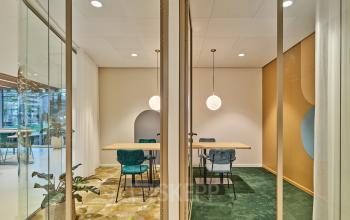 Modern office space with stylish furnishings, featuring a meeting room ideal for office space rental at Van Deventerlaan 30-40, Utrecht Papendorp.