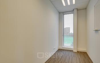Bright and inviting office space rental at Orteliuslaan 850, Utrecht Papendorp, with large window and modern lighting.