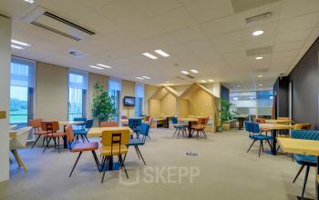 Spacious office space rental at Orteliuslaan 850, Utrecht Papendorp with colorful chairs and tables in a well-lit room