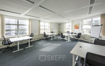 Bright office space with multiple desks and chairs, large windows with natural light at Newtonlaan 115, Utrecht Rijnsweerd.