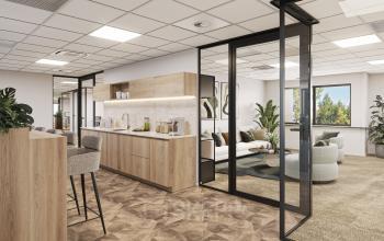 Modern, furnished office space with stylish interiors available for rent at Newtonlaan 115, Utrecht Rijnsweerd, featuring an open floorplan with a lounge area and kitchen facilities.