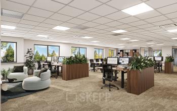 Modern office space for rent at Newtonlaan 115, Utrecht Rijnsweerd, featuring furnished workstations with greenery and ample natural light.