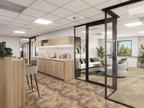 Modern, furnished office space with stylish interiors available for rent at Newtonlaan 115, Utrecht Rijnsweerd, featuring an open floorplan with a lounge area and kitchen facilities.