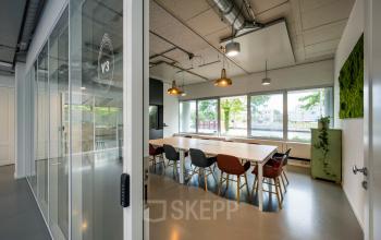 Modern office space rental with glass walls and stylish furniture at Weg der Verenigde Naties 1, Utrecht.