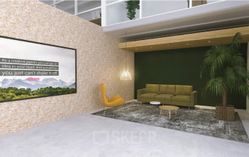 Modern workspace with a cozy seating area featuring a sofa, chair, and a decorative plant, ideal for office space rental in Utrecht South.