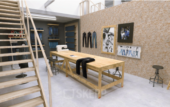 Interior view of an office space with sewing equipment and denim on display in Utrecht South, suitable for office space rental.