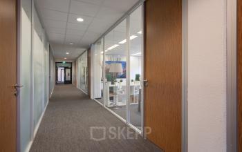 Well-equipped and modern office space rental at Winthontlaan 200, Utrecht South, with business professionals engaged in work.