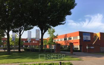 Kerkhofstraat 21 office space rental in Valkenswaard featuring a modern exterior with lush greenery