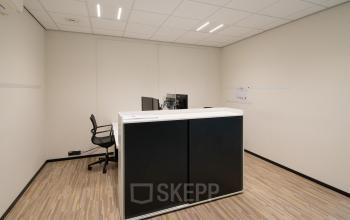 Office space rental at Gildestraat 13, Velp featuring a minimalist interior with a desk and chair, suitable for businesses seeking an office to rent.