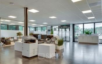 Spacious and modern office space rental at Noorderpoort 43, Venlo, featuring open workstations with natural light and contemporary decor, perfect for fostering productivity.