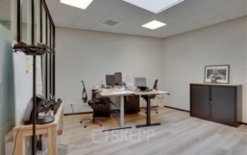 Spacious office at Noorderpoort 43 in Venlo, featuring a modern design with desks, computers, and minimal decor, ideal for office space rental.