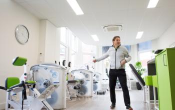 personal trainer fitness gym room green equipment