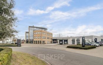 Exterior view of the office building at Keizersveld 47 47, Venray, offering ample parking space, modern architecture, and possibilities for office space rental.