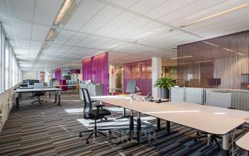 Bright and modern office space rental at Lange Dreef 10, Vianen Utr, featuring open work areas with contemporary desks and vibrant decor.