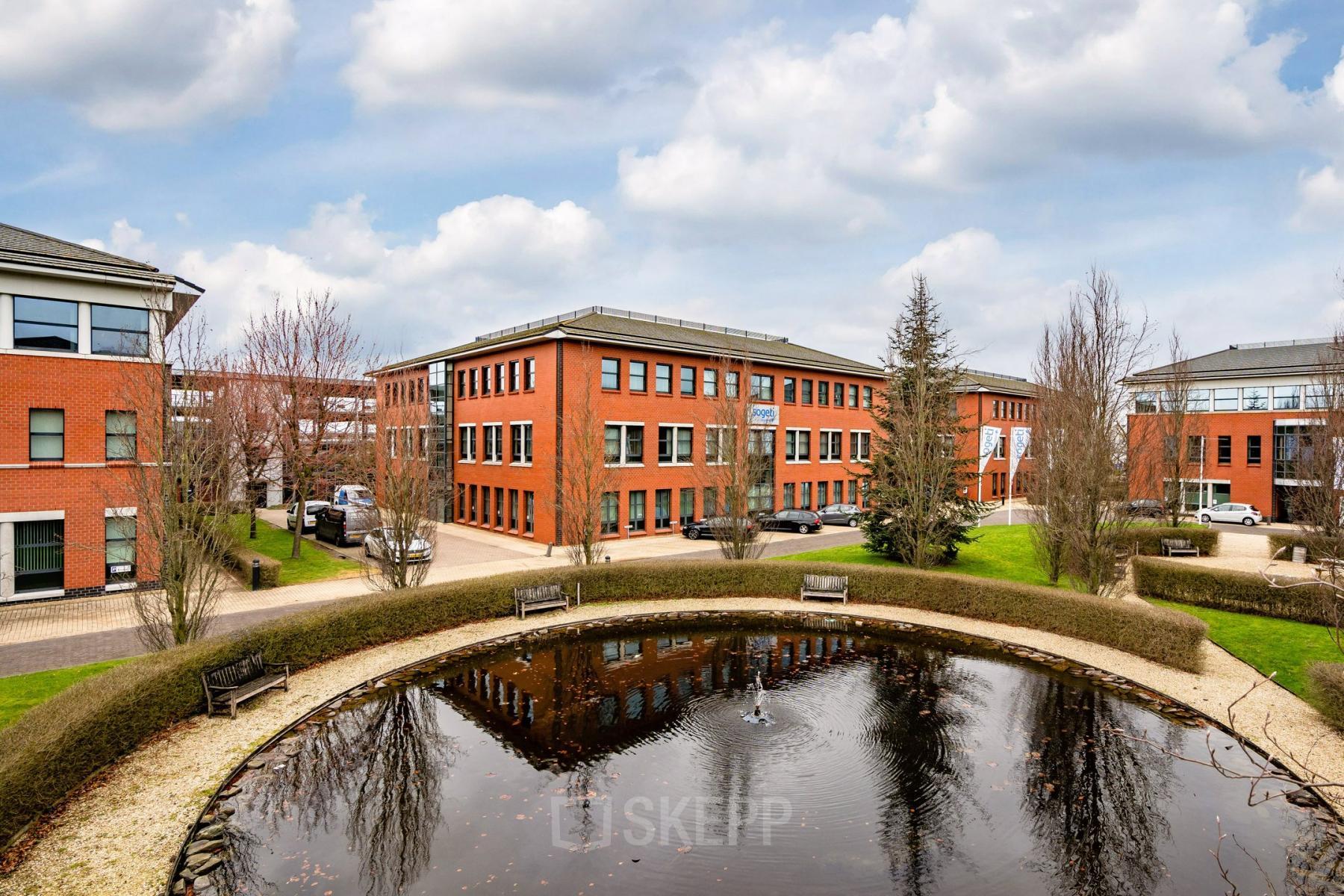 Office buildings located at Lange Dreef 17, Vianen Utr, showcasing a serene exterior with a pond and surrounding greenery, ideal for businesses seeking office space rental in a tranquil environment.