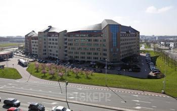 Exterior view of a modern office building at Loire 104-206 in Voorburg, featuring ample parking and easy access for potential office space rental.