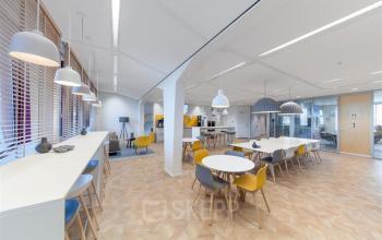 Modern office to rent at Loire 104 - 206, Voorburg, featuring stylish lighting and versatile seating arrangements, ideal for office space rental.
