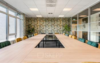 Comfortable conference room at Agro Business Park 22 in Wageningen, ideal for office space rental with a spacious setup for business meetings.