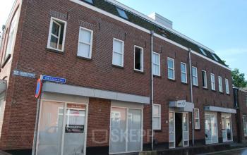 Exterior view of office space rental at Van Loonstraat 1B in Woerden, showcasing the building's facade and entrance.