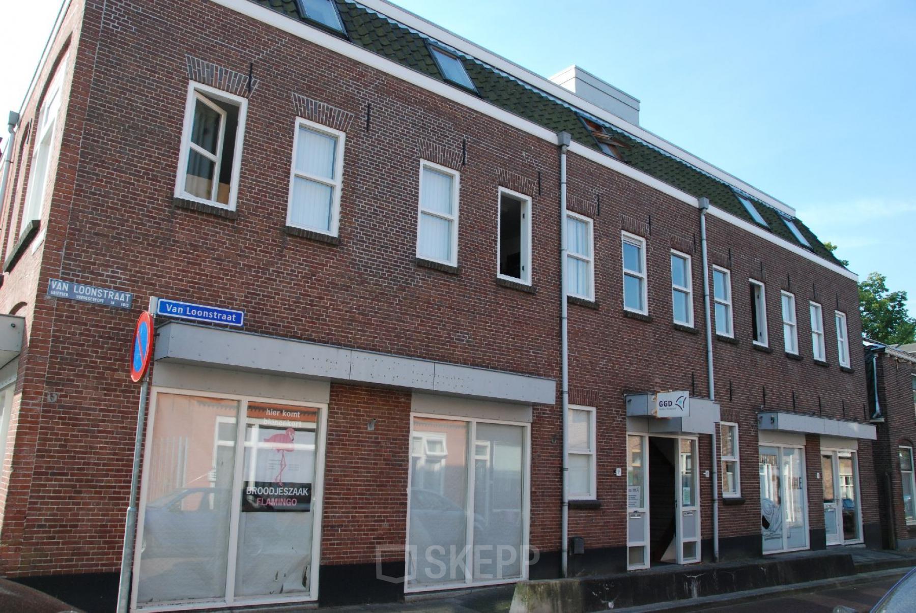 Exterior view of office space rental at Van Loonstraat 1B in Woerden, showcasing the building's facade and entrance.
