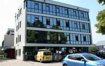 Modern office space rental at Lindenhof 7 in Woerden with large windows and a professional facade.