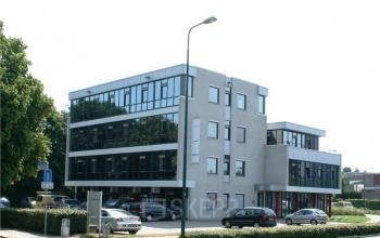 Modern office space rental at Lindenhof 7, Woerden with a clean architectural design and well-lit windows.