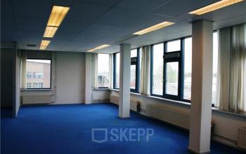 Spacious office space rental at Lindenhof 7 in Woerden, with large windows and ample natural light.
