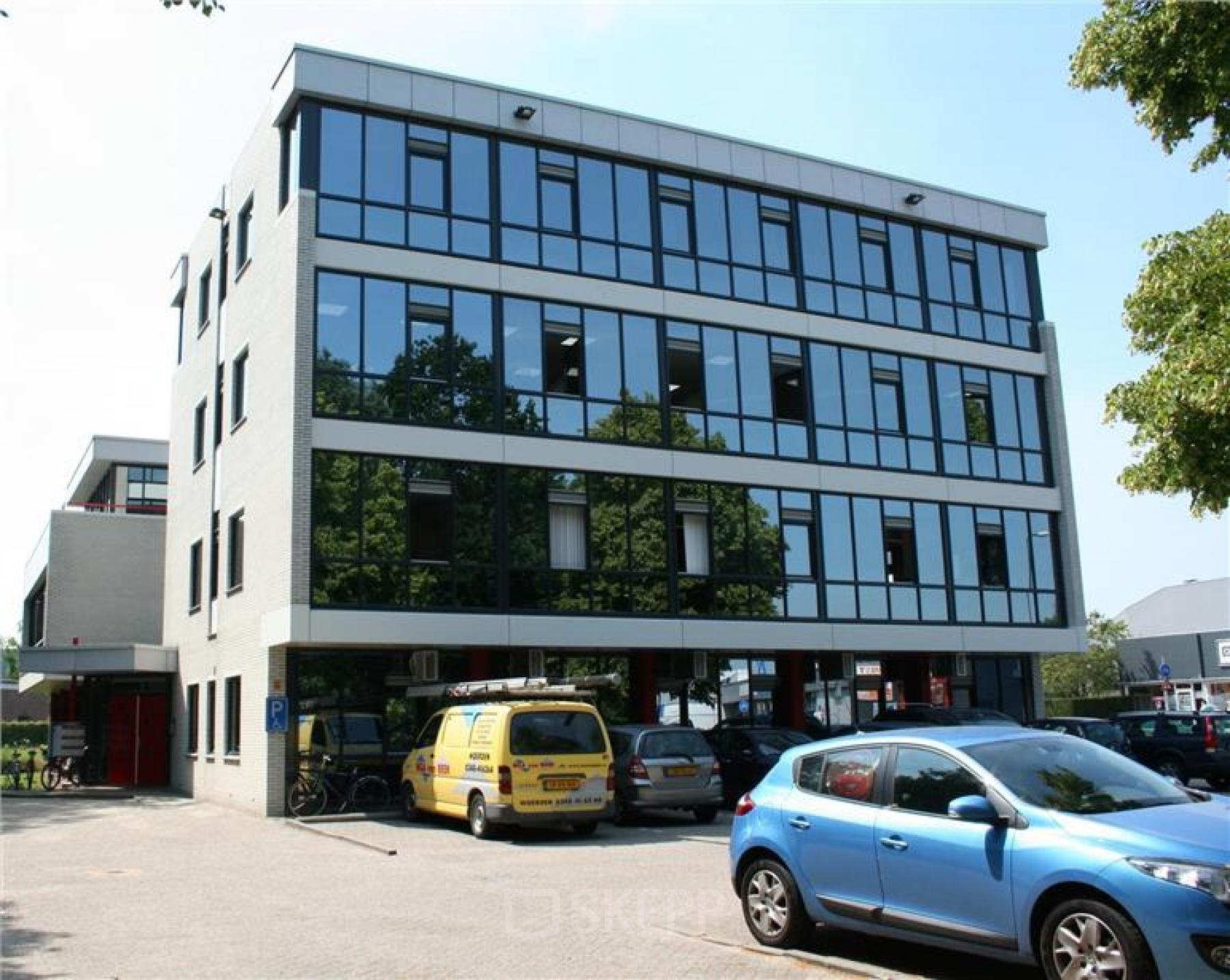 Modern office space rental at Lindenhof 7 in Woerden with large windows and a professional facade.