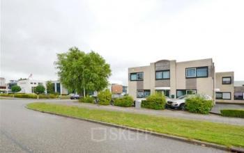 Exterior view of office building located at Pelmolenlaan 17A, Woerden, showing a two-story structure with a parking lot in front.