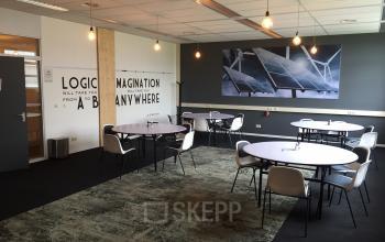 Modern Woerden office space rental at Korenmolenlaan 4, featuring stylish furnishings and well-lit work environment.