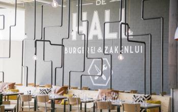 Modern office space rental at Korenmolenlaan 4 with stylish decor and well-lit dining or meeting area in Woerden.