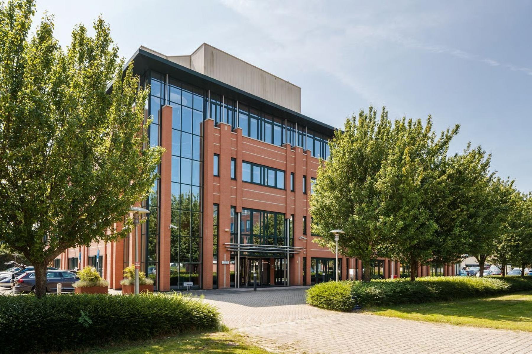 Exterior view of the office building at Vijzelmolenlaan 9 in Woerden, showcasing modern architecture perfect for office space rental.