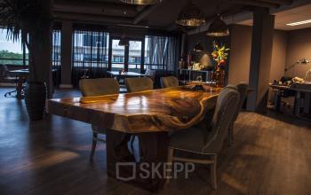 Spacious and modern conference room with a unique wooden table at Zaagmolenlaan 4, Woerden, ideal for office space rental.