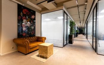 Inviting office space at Boerhaavelaan 40 in Zoetermeer featuring a cozy lounge area with a sofa and unique decor, perfect for rent office space seekers.