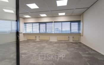 Spacious office space with large windows and ample natural light at Boerhaavelaan 40, Zoetermeer. Ideal for office space rental.