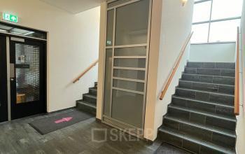 Entrance area at Baron de Coubertinlaan 35, Zoetermeer, featuring clean stairs and signage ideal for office space rental.
