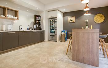 Modern pantry area in Zürich Riesbach office space rental at Seefeldstraße 69 with furnished kitchenette and dining space.