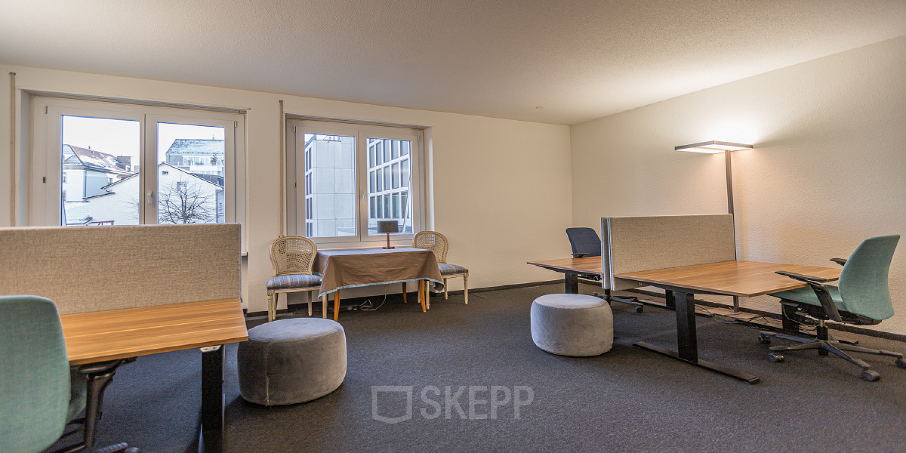 Spacious and well-lit office space rental at Kreuzstrasse 24, Zürich Seefeld, with comfortable seating and organized workspaces.