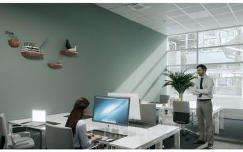 Elegant office space rental at Dufourstrasse 49, Zürich Seefeld, with modern furnishings and a focused businessman standing.
