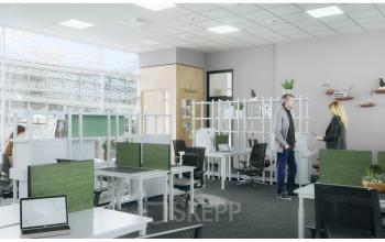 Modern office space rental at Dufourstrasse 49, Zurich Seefeld, with employees engaged in a discussion and working at desks.