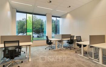 Modern office space in Zwolle with natural light, open layout, and functional workstations available for office space rental.